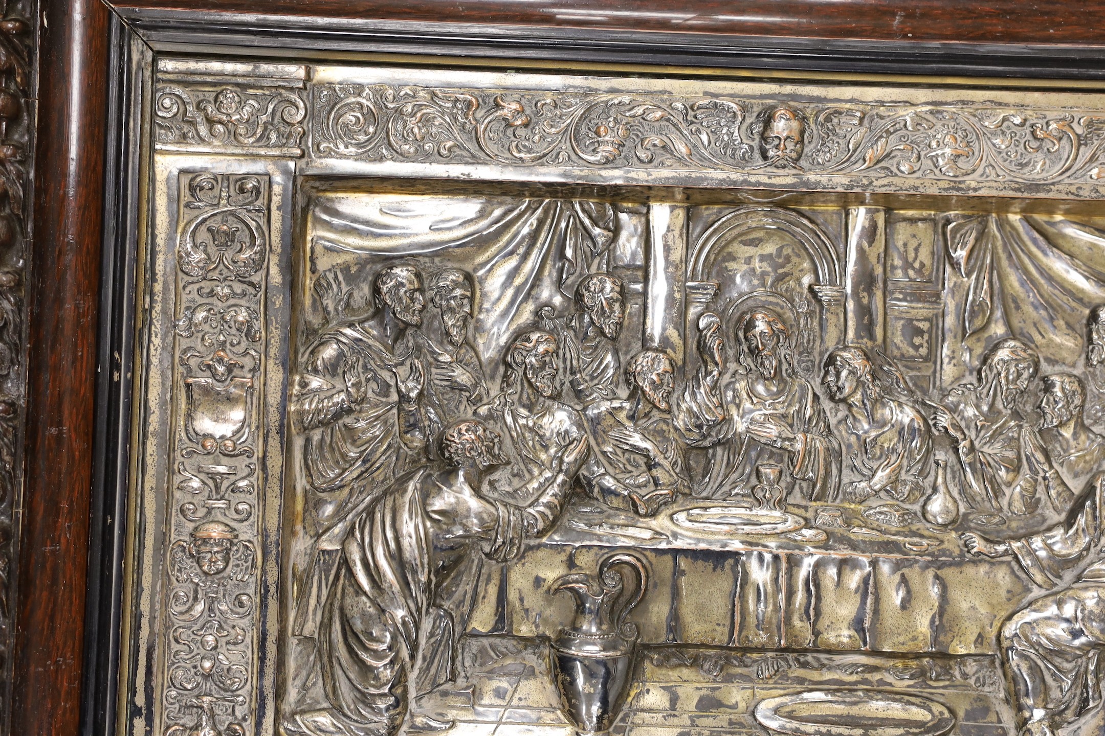 A framed embossed plaque, The Last Supper, silver plate on copper, 34.5 x 50cm excl frame